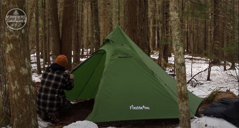 open the door of a firehiking hot tent